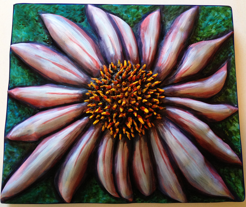 A sculpted cake designed to look like a purple coneflower with pink and white striped petals and a textured orange center, set against a mottled green background.