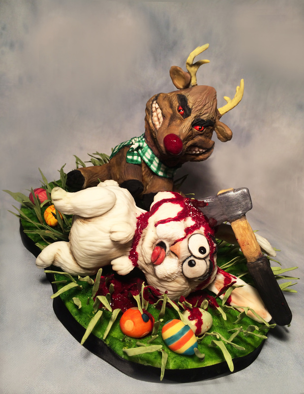 A sculpted cake diorama depicts a monstrous reindeer with glowing red eyes standing over a fallen Easter bunny, with an axe embedded in the bunny's head amidst scattered Easter eggs and grass.