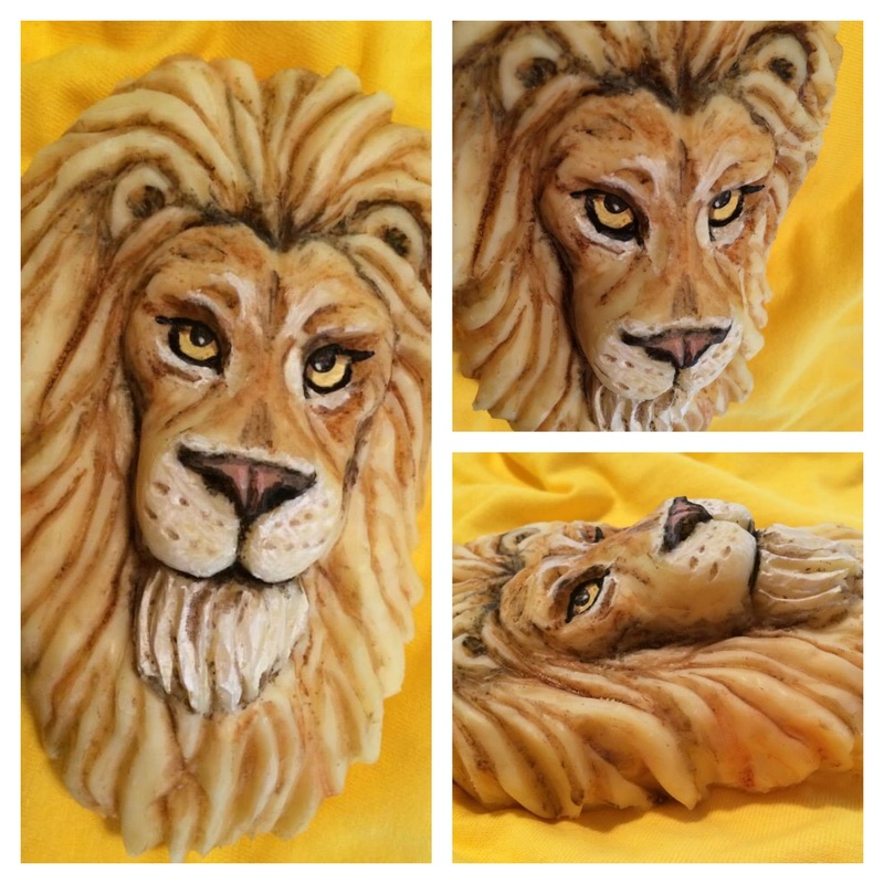 A collage of three views displays a hand-carved cheese lion head sculpture with detailed facial features and textured mane, set against a vibrant yellow fabric background.