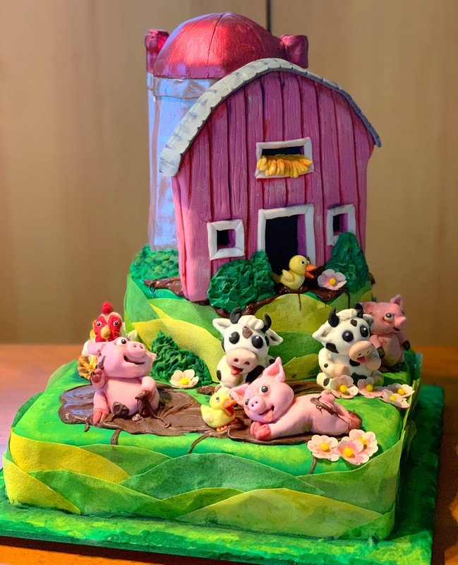 A whimsical farm-themed cake features a pink barn with a red dome roof perched atop a green, rolling hill base, surrounded by fondant cows, pigs, ducks, and a rooster.