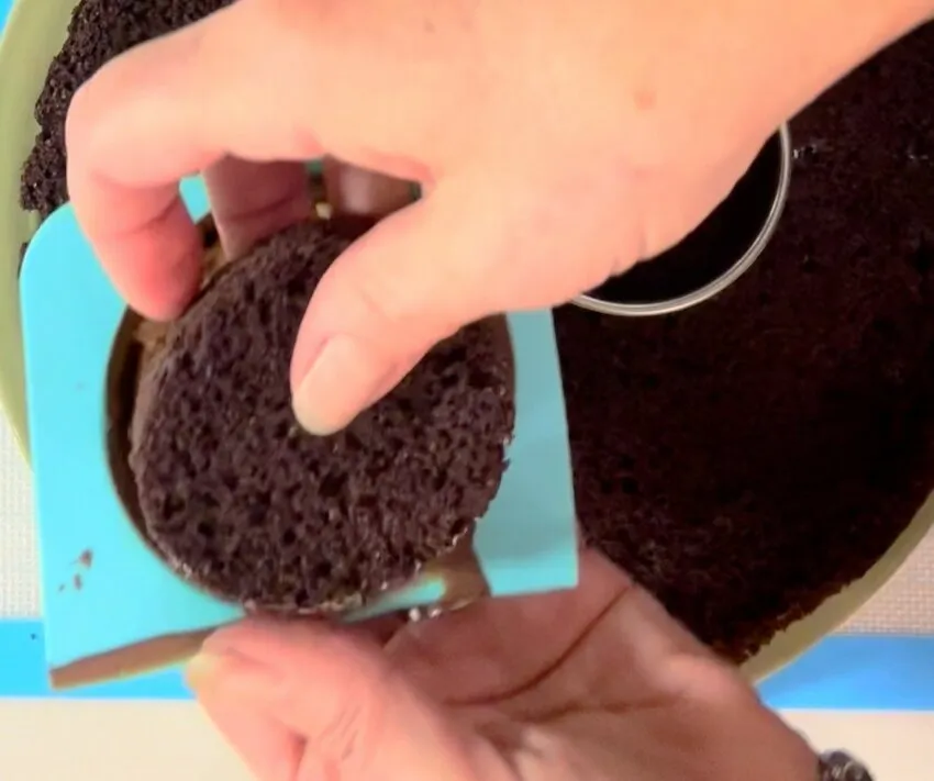 Cutting a piece of cake with a square cutter.