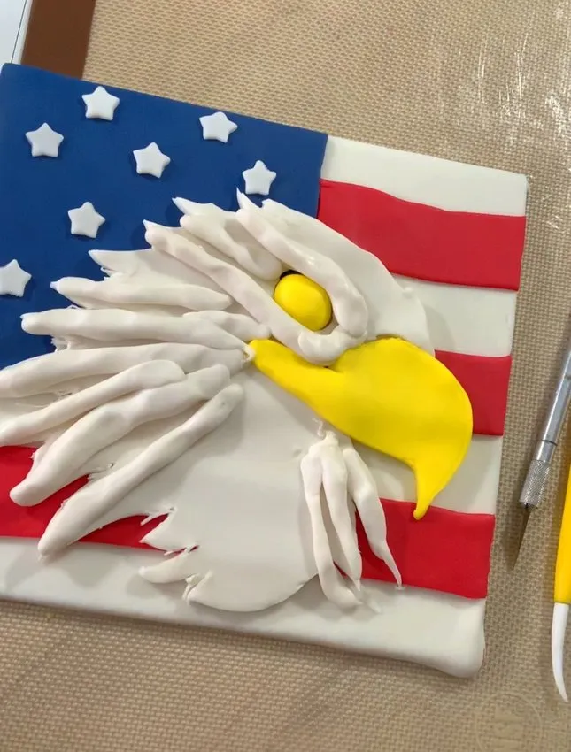 White fondant strips added for feather texture on the eagle head.