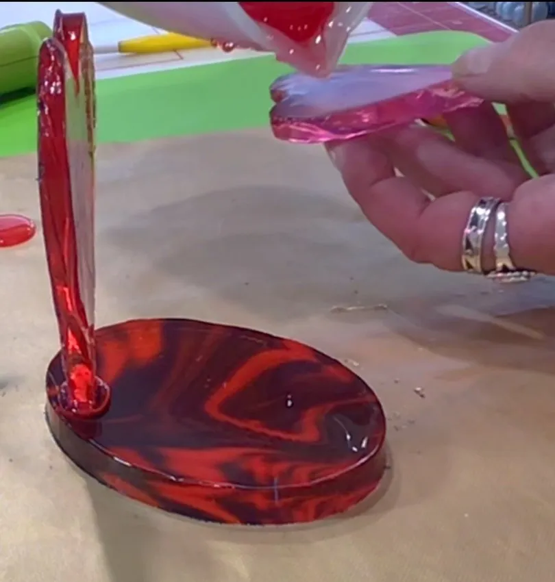Assembled marbled isomalt heart pieces being joined together.