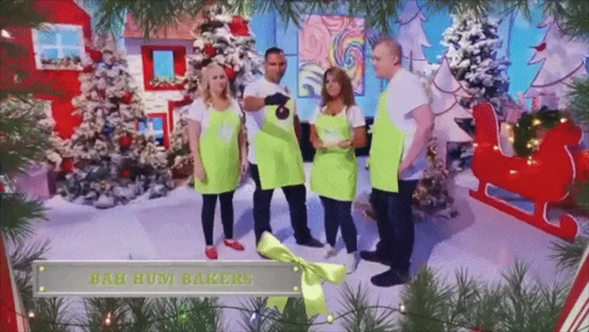 The Bah Hum Bakers team in lime green aprons on the Holiday Wars set.
