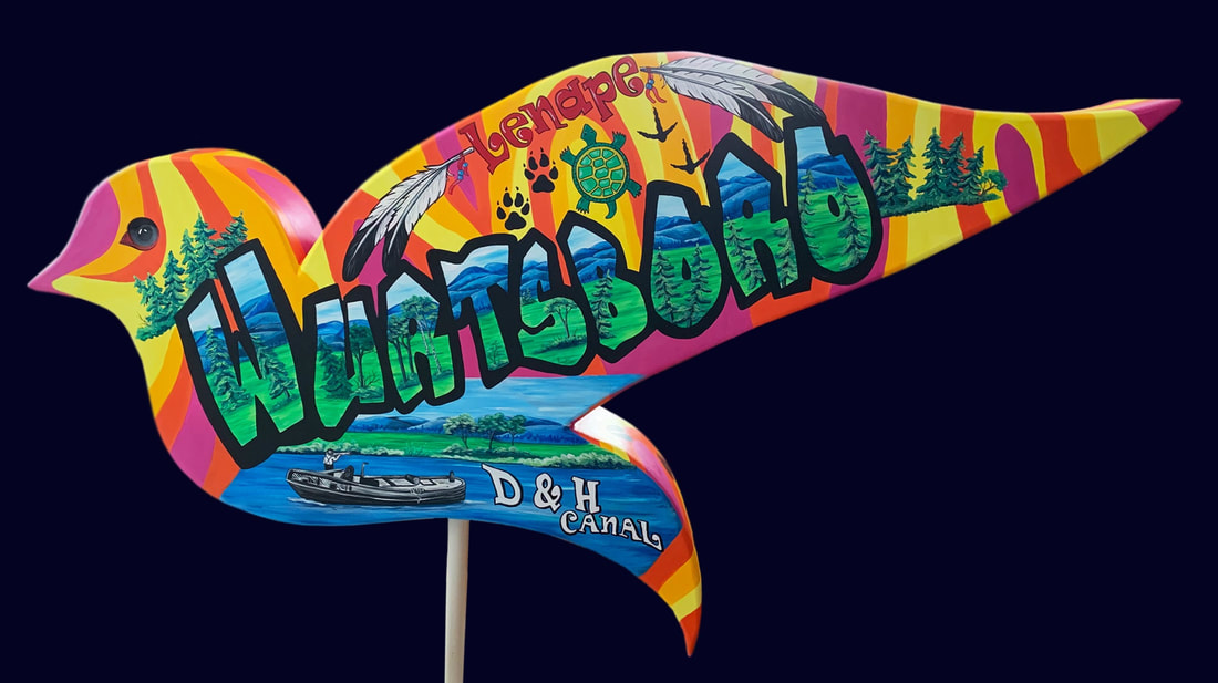 A colorful, bird-shaped wooden sign painted with vibrant stripes and nature scenes, featuring the text "Lendep Huntsford" and "D & H Canal" along with illustrations of trees, mountains, a turtle, paw prints, and a canal boat.