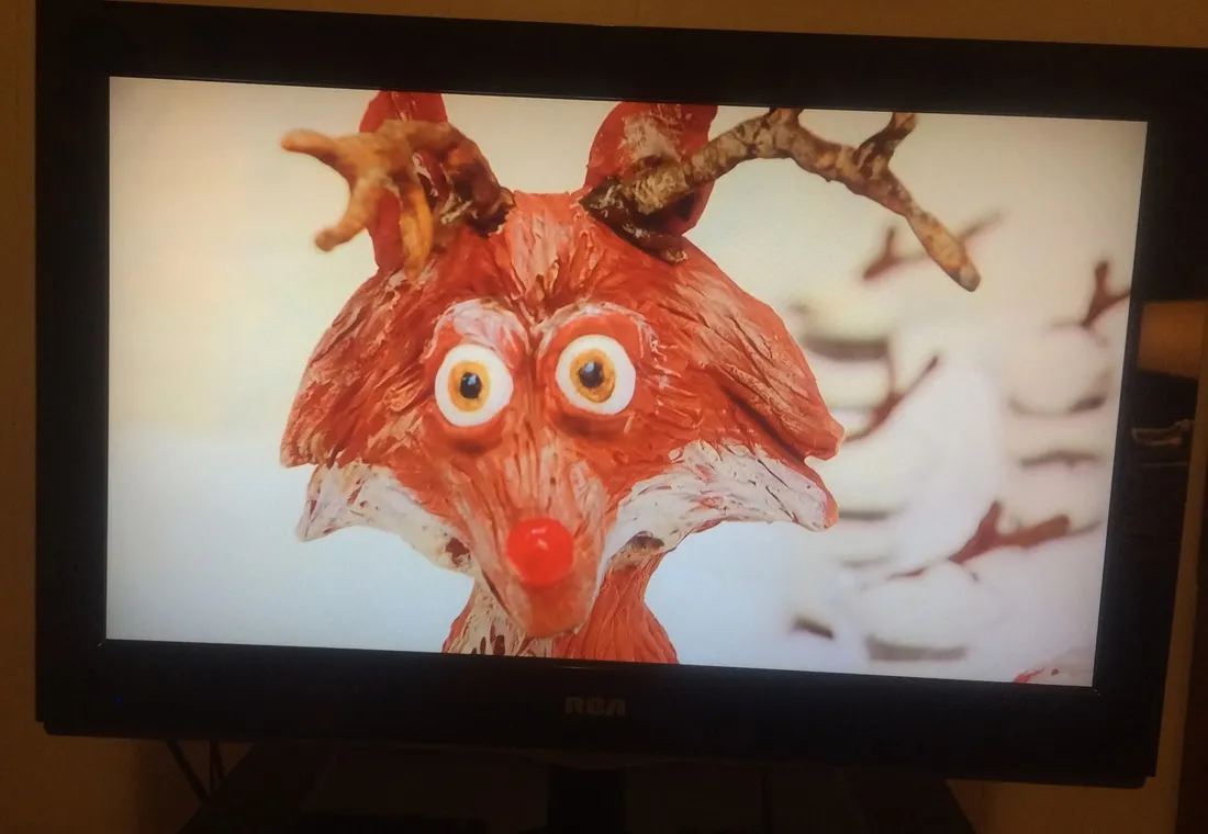 A claymation reindeer on an RCA television screen.