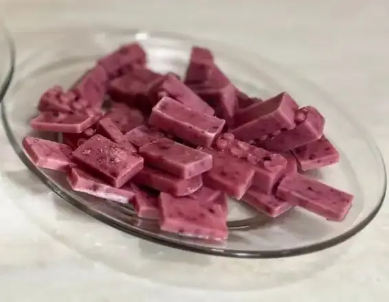 Frozen dog berry treats on a plate