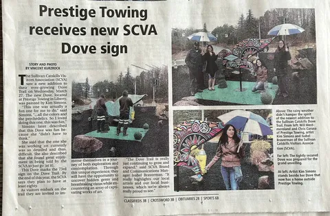 Newspaper article about an SCVA Dove sign featuring a psychedelic dove sculpture.