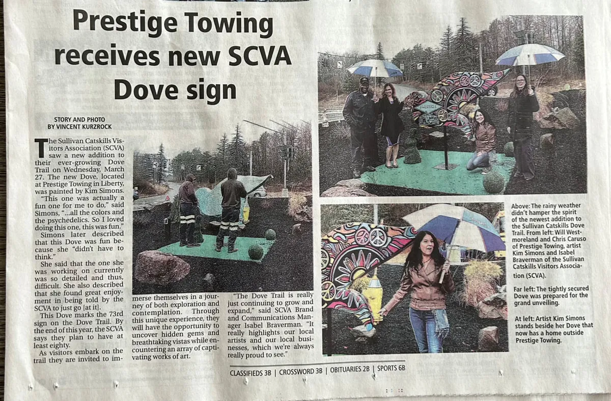 Newspaper article about an SCVA Dove sign featuring a psychedelic dove sculpture.