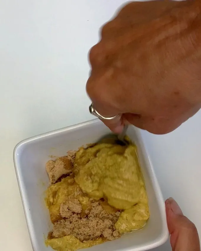 Mixing glaze ingredients in a small bowl