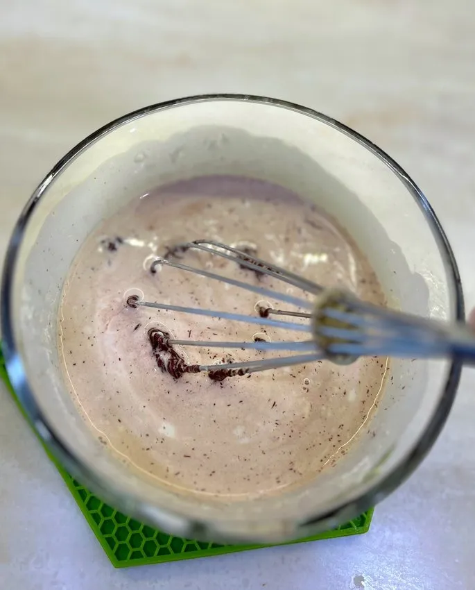 Whisking the cream and chocolate mixture together