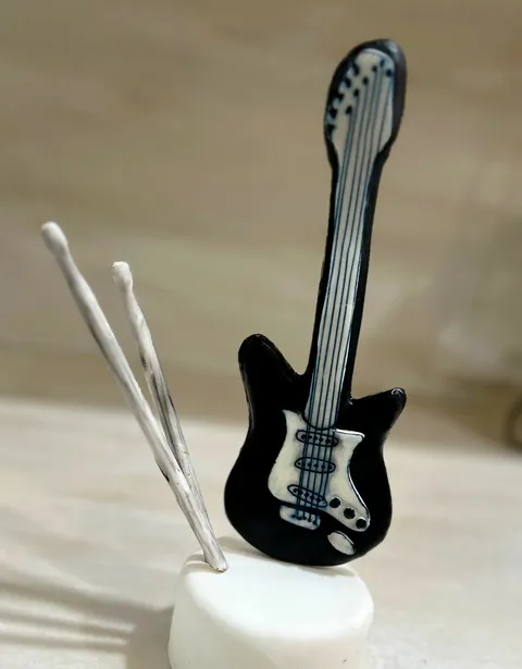 Fondant-covered musical instrument cookies