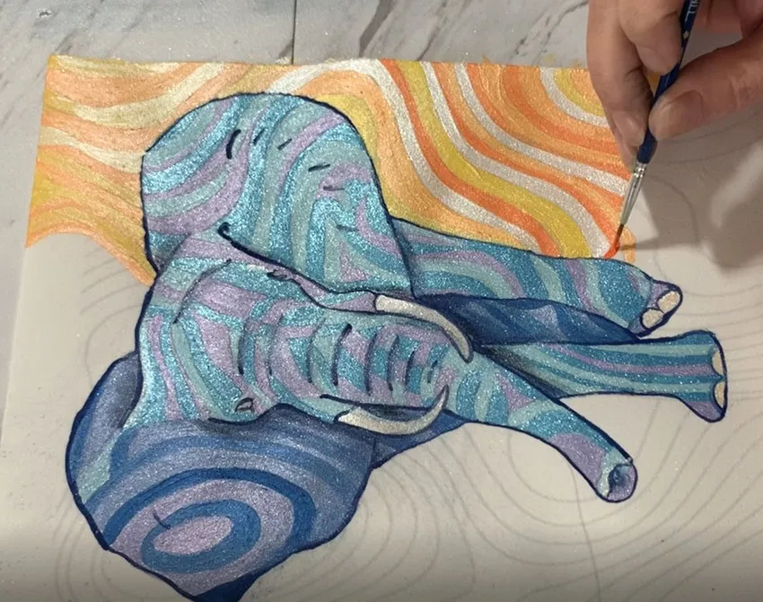 Painting wavy orange and yellow background colors.