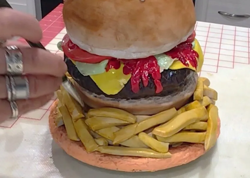 Fondant french fries and painted details on the finished burger cake plate.