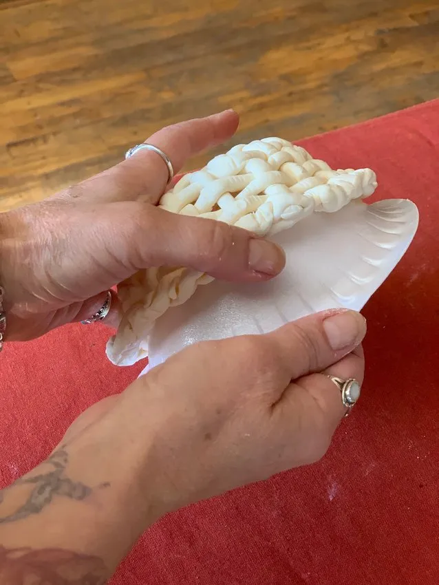 Removing the chocolate basket from the Styrofoam mold