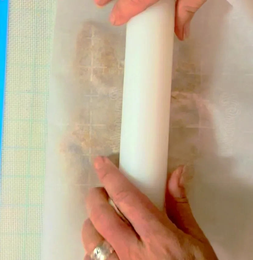 Rolling peanut butter filling flat with a rolling pin.
