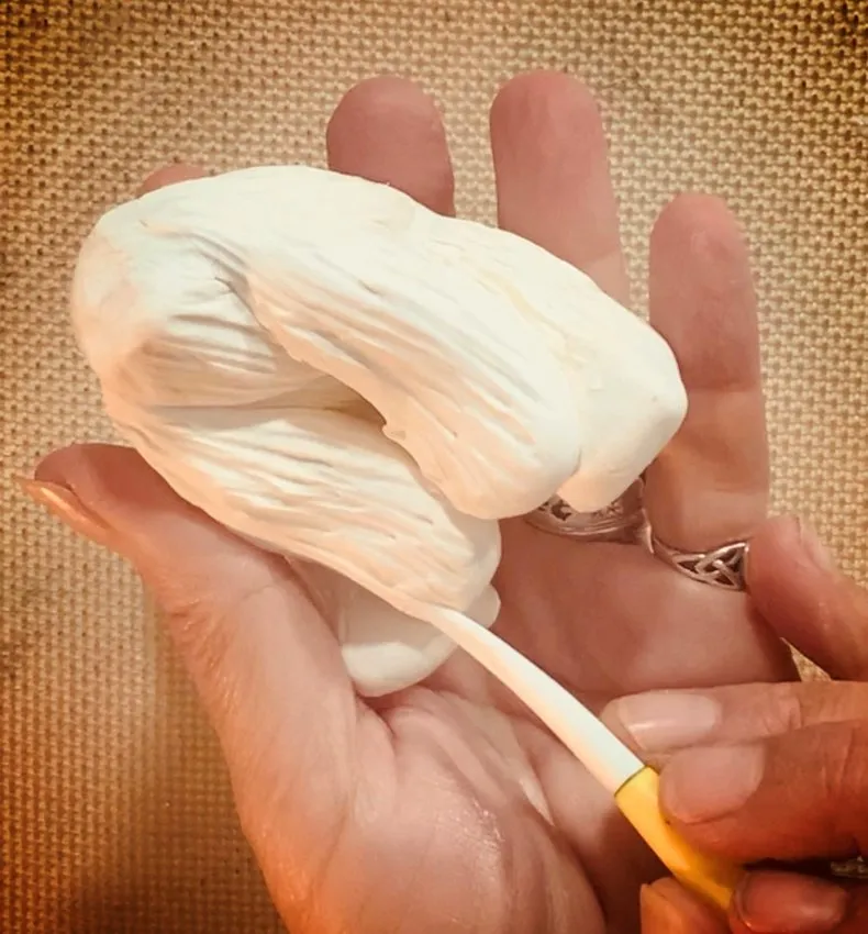 Shaping and attaching an arm to the polar bear body.
