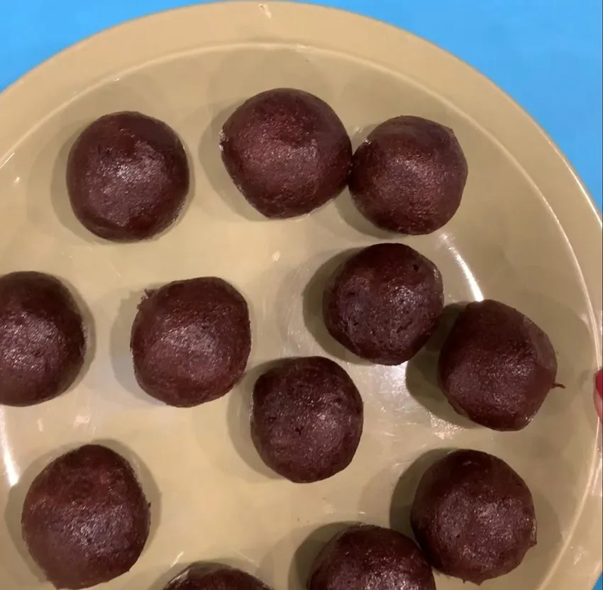 Shaped cake balls on a plate ready for refrigeration.