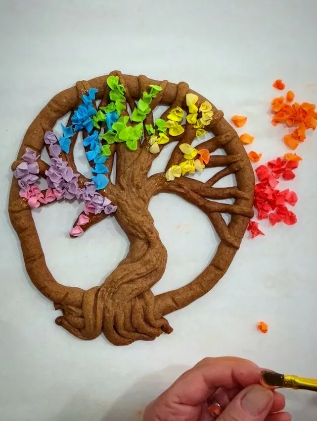 Shaping wafer paper circles into small flowers.