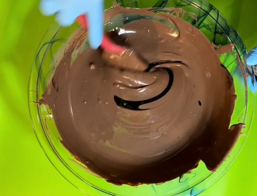 Stirring melted chocolate with a spatula