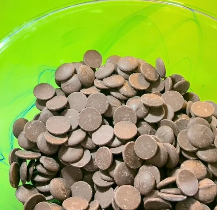 Chocolate wafers in a lime green bowl