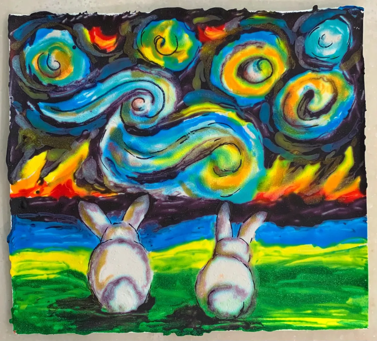Two edible-paper bunnies painted in Van Gogh style with a swirling, colorful background