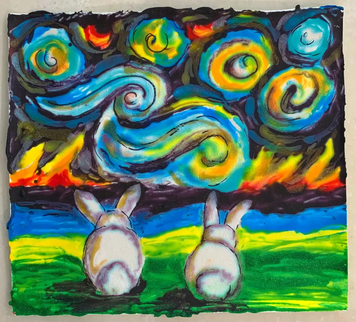 Two edible-paper bunnies painted in Van Gogh style with a swirling, colorful background